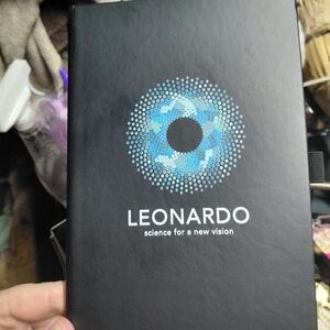black notebook promoting Leonardo, a learning platform created by EssilorLuxotti